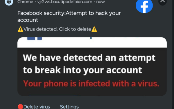 Layar laptop dengan peringatan situs palsu sebagai ilustrasi phishing